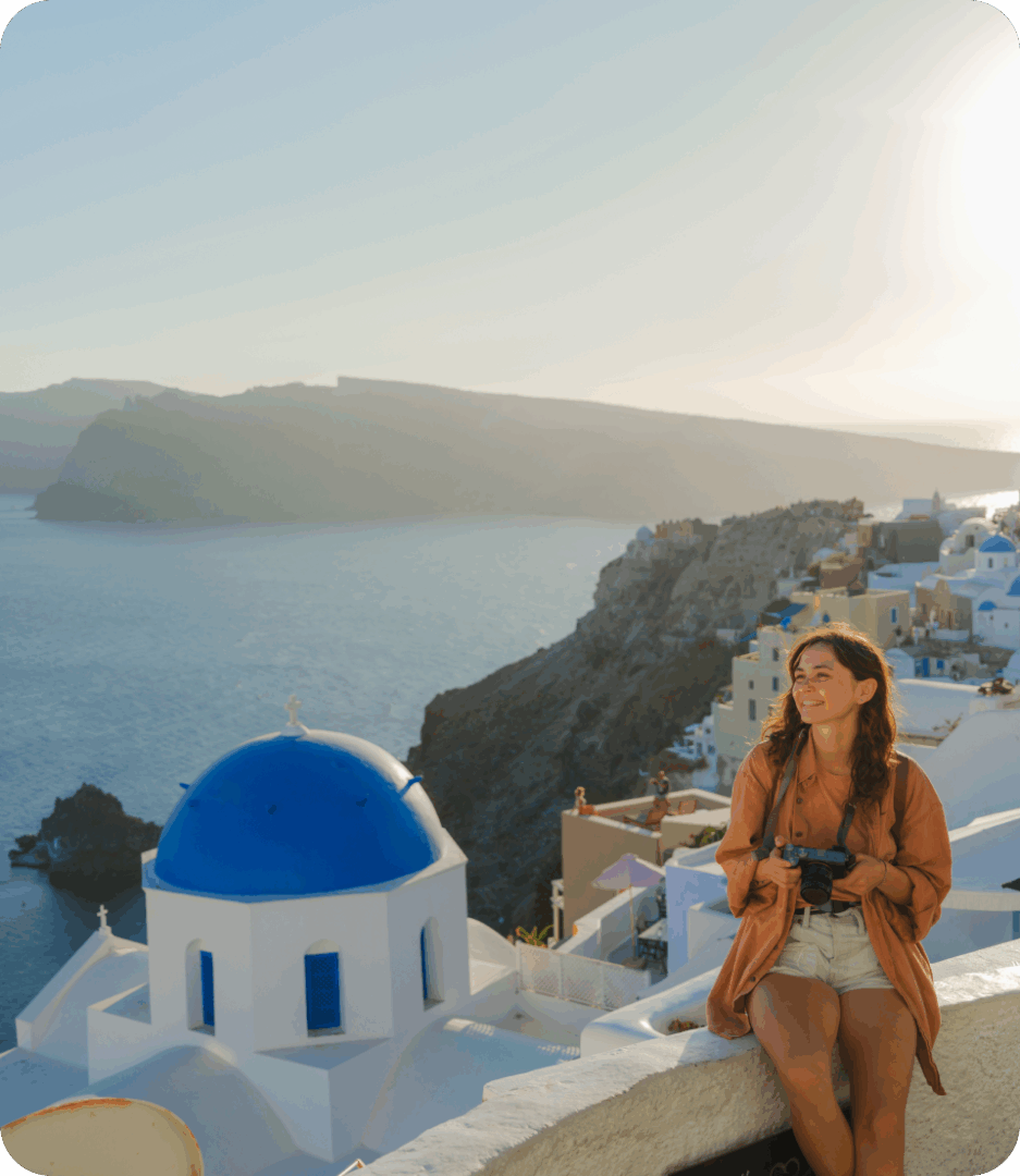 Woman enjoying Santorini view by the sea.