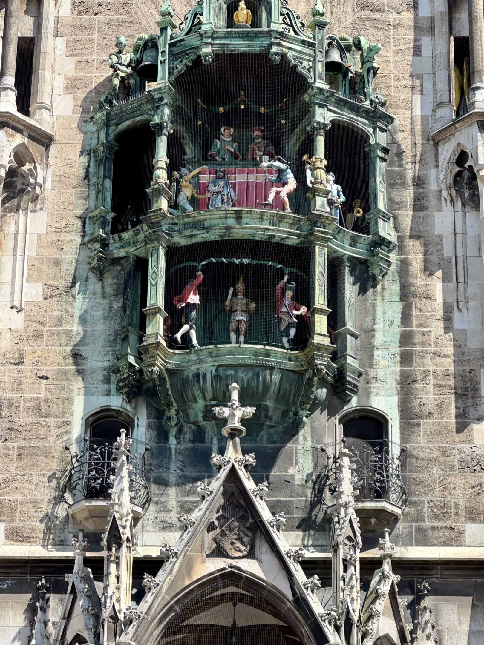 Historic clock tower with intricate sculptures and figures.