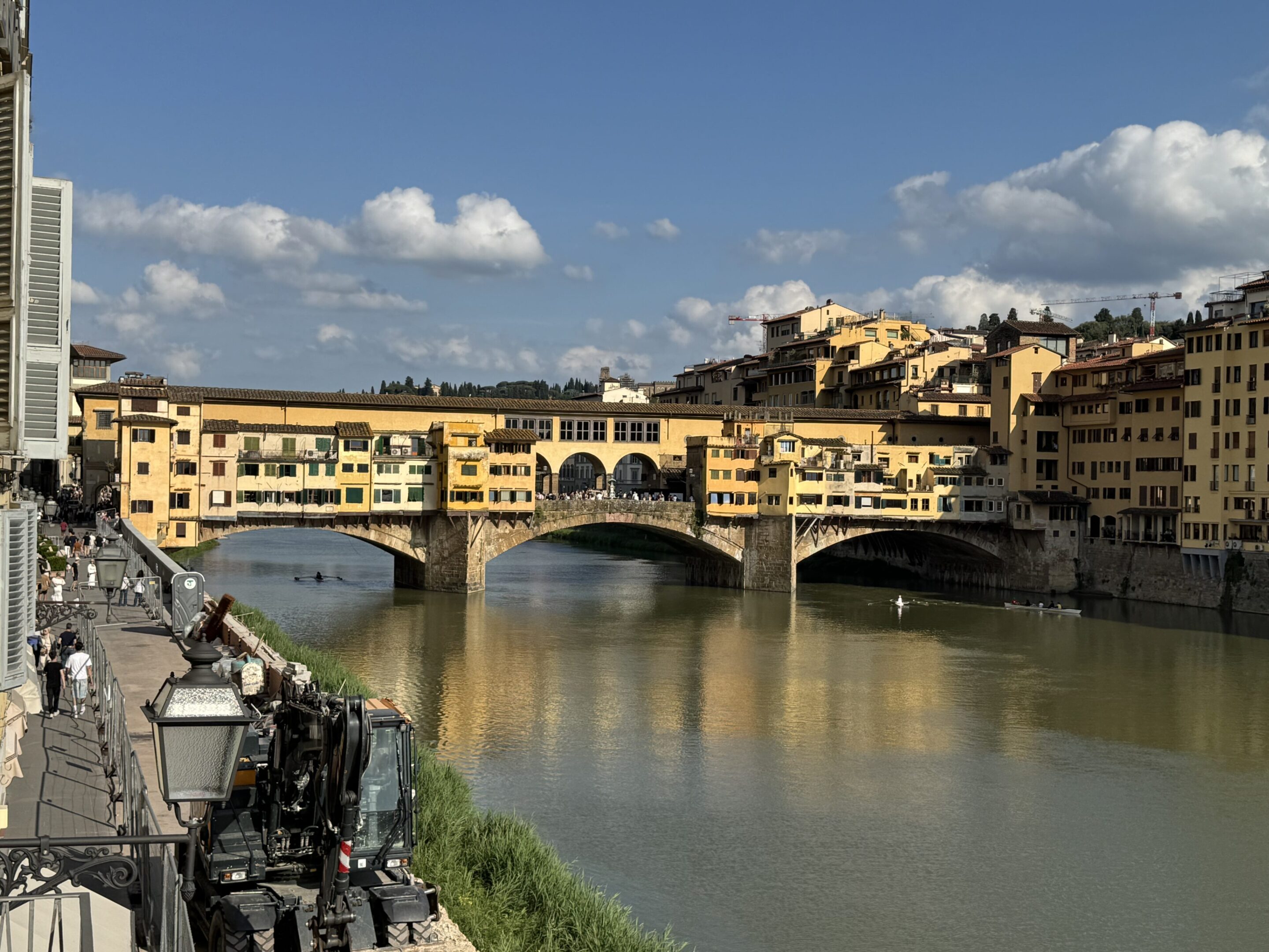 View of the historic Ponte Vecchio bridge over the Arno River in Florence, Italy.